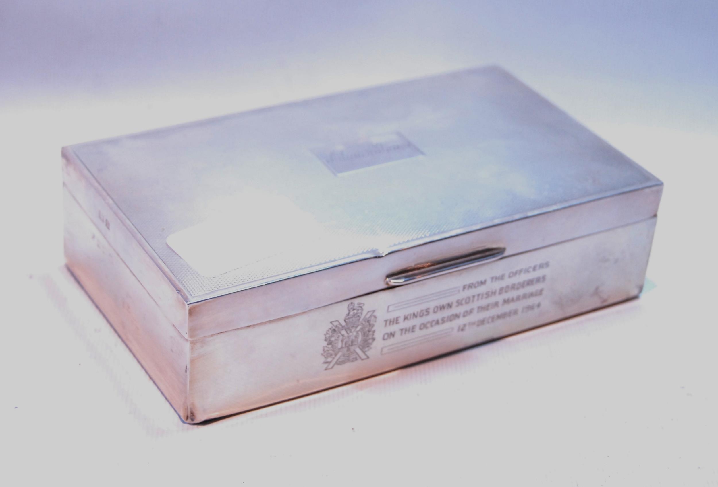 Silver cigarette box, engine turned, 1964, 15cm x 9cm.