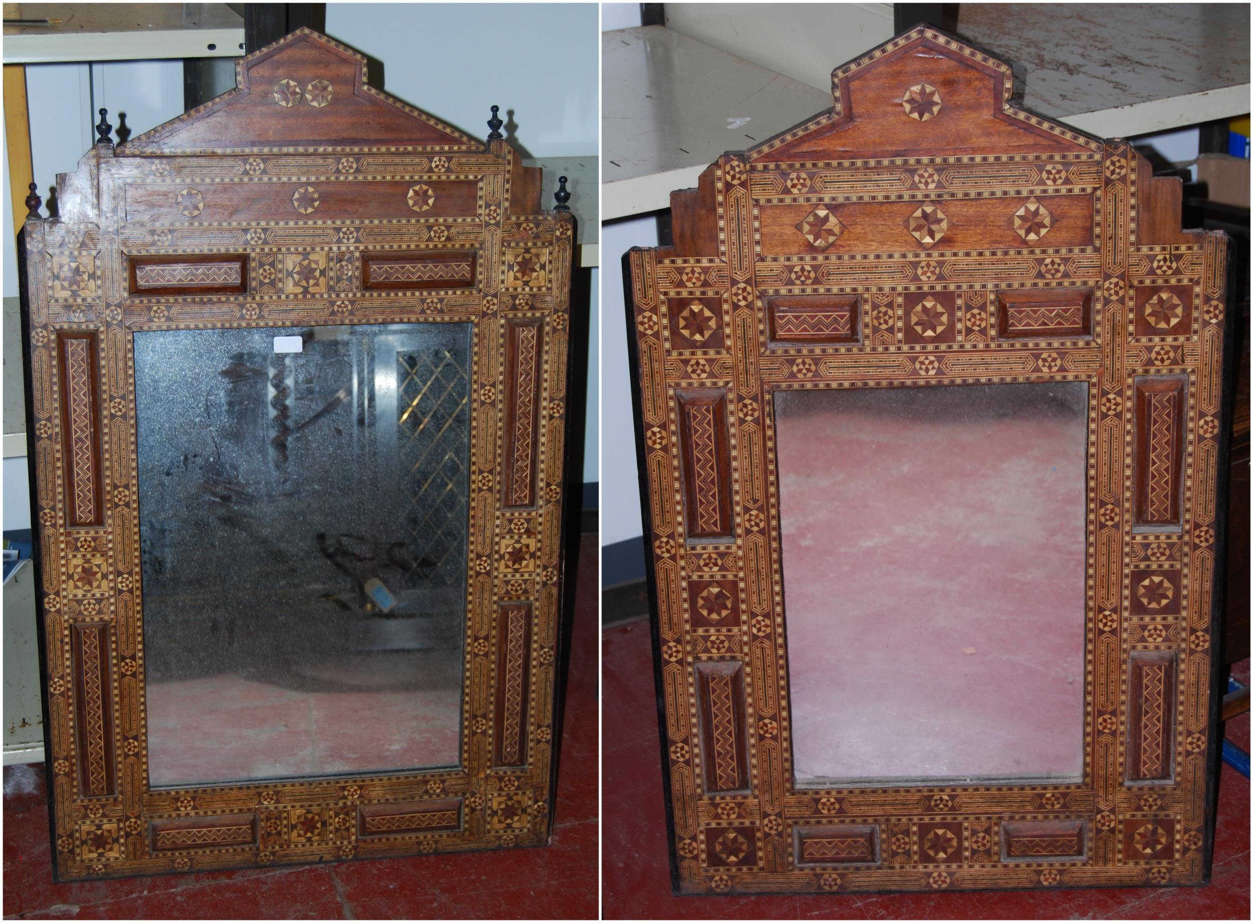 Antique Indo-Persian marquetry inlaid wall mirror with finial surmounts above all over marquetry