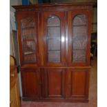 Victorian mahogany library bookcase with Gothic-influenced roundels to the shaped cornice above