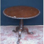 Georgian mahogany supper table, with circular tilt top on a cylindrical column and tripod supports