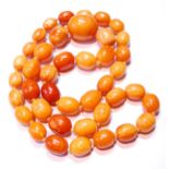 Amber necklace of ovoid beads, 153g.