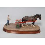 Border Fine Arts group modelled as a farmer with a horse and discs, on a fixed stand, 29cm wide.