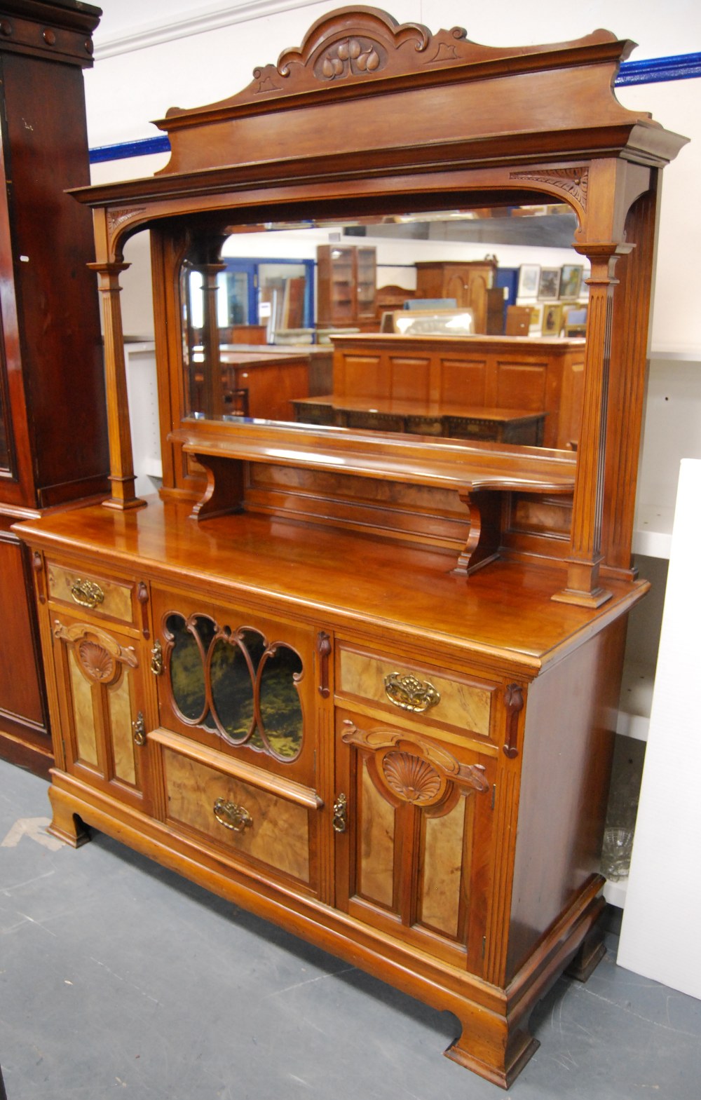 Art Nouveau mahogany and walnut mirror-back sideboard, retailed by J Farrar & Sons, Halifax, the