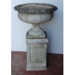 Composition garden campagna urn of large form, on a fixed circular foot and plinth base, on