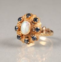 Ladies 14 carat gold opal and sapphire ring, central opal surrounded by eight small sapphires ring