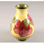 Moorcroft pottery vase, yellow ground, decorated with hibiscus pattern height 21cm