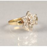 Ladies 18 carat gold diamond daisy cluster ring, central diamond 0.33 carats surrounded by six 0.