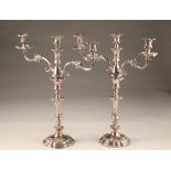 Pair large electro plated sliver three light candelabra, lobed circular based with foliate relief,