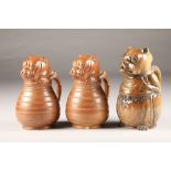 Pair of glazed French bulldog pottery jugs, marked Depose circa 1890's, height 22cm and another