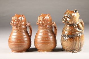 Pair of glazed French bulldog pottery jugs, marked Depose circa 1890's, height 22cm and another