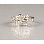 Crossover diamond eternity ring, with unmarked white metal shank. ring size L