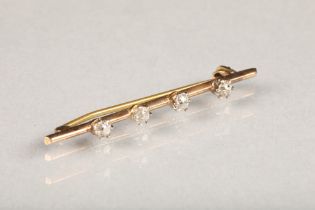 Ladies yellow metal diamond bar brooch set with four 0.15 carat diamonds, length 5cm