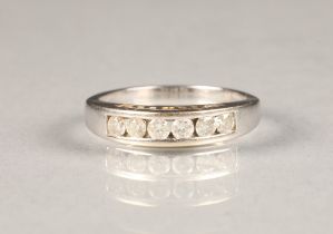 18 carat white gold and diamond ring, channel set with six brilliant cut diamonds. ring size P,