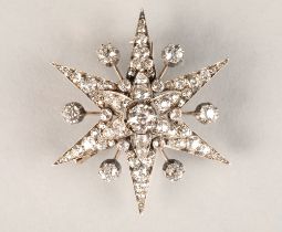 Victorian diamond encrusted star burst brooch, central diamond 0.75 carat, mounted on white metal