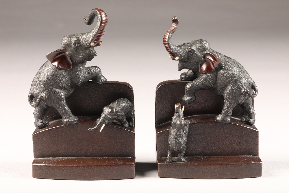 Pair late 19th/20th Century Japanese bronze bookends, stepped form with an applied adult elephant