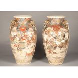 Large pair of Japanese vases depicting samurai warriors, with gilt dragon mask handles, character