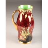 Carlton ware lustre vase, single gilt handle, decorated with rouge royal bluebell pattern circa