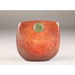 Peter Hayes (British Born 1946) A raku bow with fractured red surface and green disc, incised