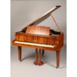 Mahogany cased baby grand piano by B Squire and Son London, raised on square tapered legs, length