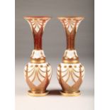 Pair of Bohemian white overlay and gilt ruby vases, of flared baluster form, height 38cm