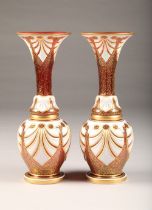 Pair of Bohemian white overlay and gilt ruby vases, of flared baluster form, height 38cm