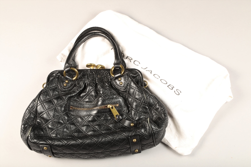 Black quilted clasp Marc Jacobs handbag with red interior with Marc Jacobs dust bag