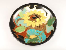 Pottery wall charger, decorated with stylised flowers, LHZON 424 Arnhem Holland, diameter 41cm