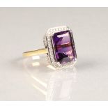 18 carat gold amethyst and diamond ring, large emerald cut amethyst surrounded by diamonds. ring