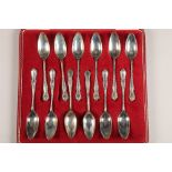 Boxed set of twelve sliver tea spoons, assay marked London 1959 by Garrard & Co, total weight 412g