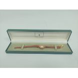Lady's Gucci quartz rolled gold watch, on strap, cased.