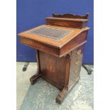 Victorian Davenport with drop-front and tooled leather writing slope below an enclosed stationary