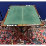 Edwardian campaignstyle mahogany folding card table, with baize playing surface and inset ivory