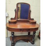 Victorian mahogany bow front dressing table, with swing mirror above two small drawers with a
