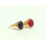 9ct gold signet ring, with oval carnelian, and another onyx, 7.5g gross, sizes 'U' and 'R'.