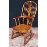 Antique yew wood and elm Windsor rocking chair with hoop frame, stick back with pierced splat, pad