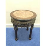 Early 20th century Chinese hardwood jardinière stand, with circular marble inset to the top, above