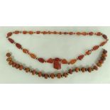 Amber necklace of tablet links with drops, 85g and another.  (2)