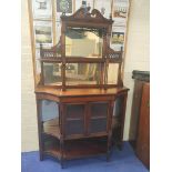 Late Victorian mahogany three tiered mirrored sideboard the cupboard base flanked by two shelves and