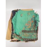 Eastern embroidered green cotton tunic with matching trousers, hat and belt, a feather fan, a