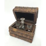 Early 20th century French tooled decanter box,  the exterior in the form of three stacked