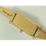 Gucci gilt metal evening watch, and eight others, quartz.