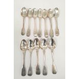 Set of twelve silver dessert spoons, crested fiddle pattern, by C Cummins, Dublin, 1827, 280g.