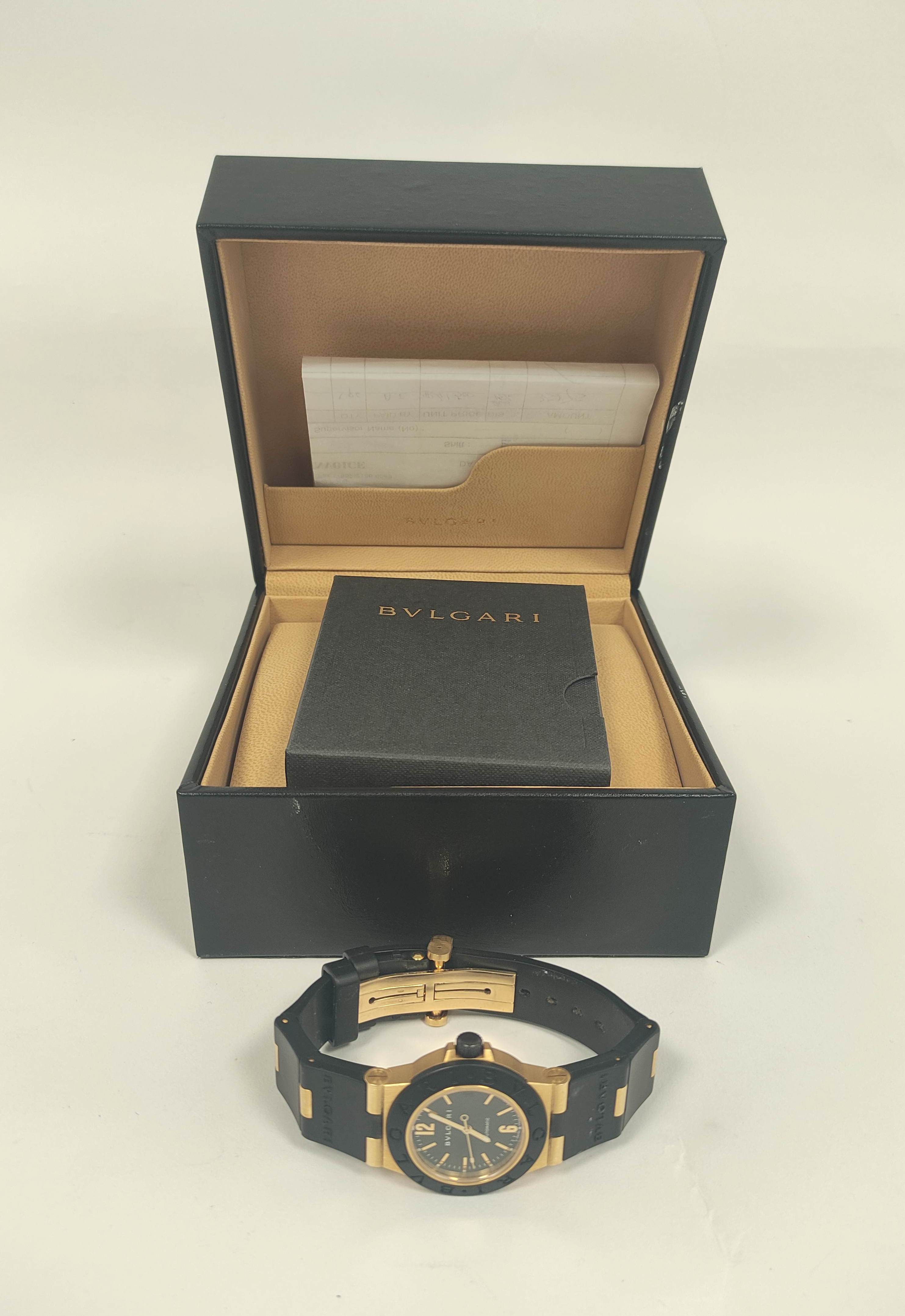 Bulgari AL32 automatic watch, 18ct gold and butyl, with receipt and other items, in box.