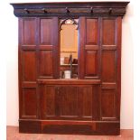English Arts & Crafts oak hallstand, with naturalistic cornice and five ornate pegs above a Gothic