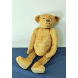 Exceptional early 20th century straw filled mohair teddy bear with elongated articulated limbs,