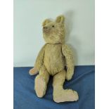 Early 20th century straw filled mohair teddy bear with hunch back a/f.