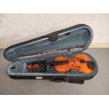 Modern 1/2 size violin by Stagg. Spruce top and two piece maple back. Complete with case and bow.