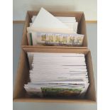 Two boxes containing a large quantity of Jersey and Alderney first day covers and stamp booklets.