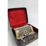 Hohner accordion in fitted case.