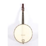 Barnes and Mullins of London four string banjo with mahogany neck and open back, 61cm long